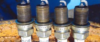 What does carbon deposits on spark plugs and its color indicate?
