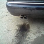 Why is black liquid dripping from the muffler?