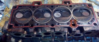Cylinder head gasket on a VAZ-2114 near the engine removed